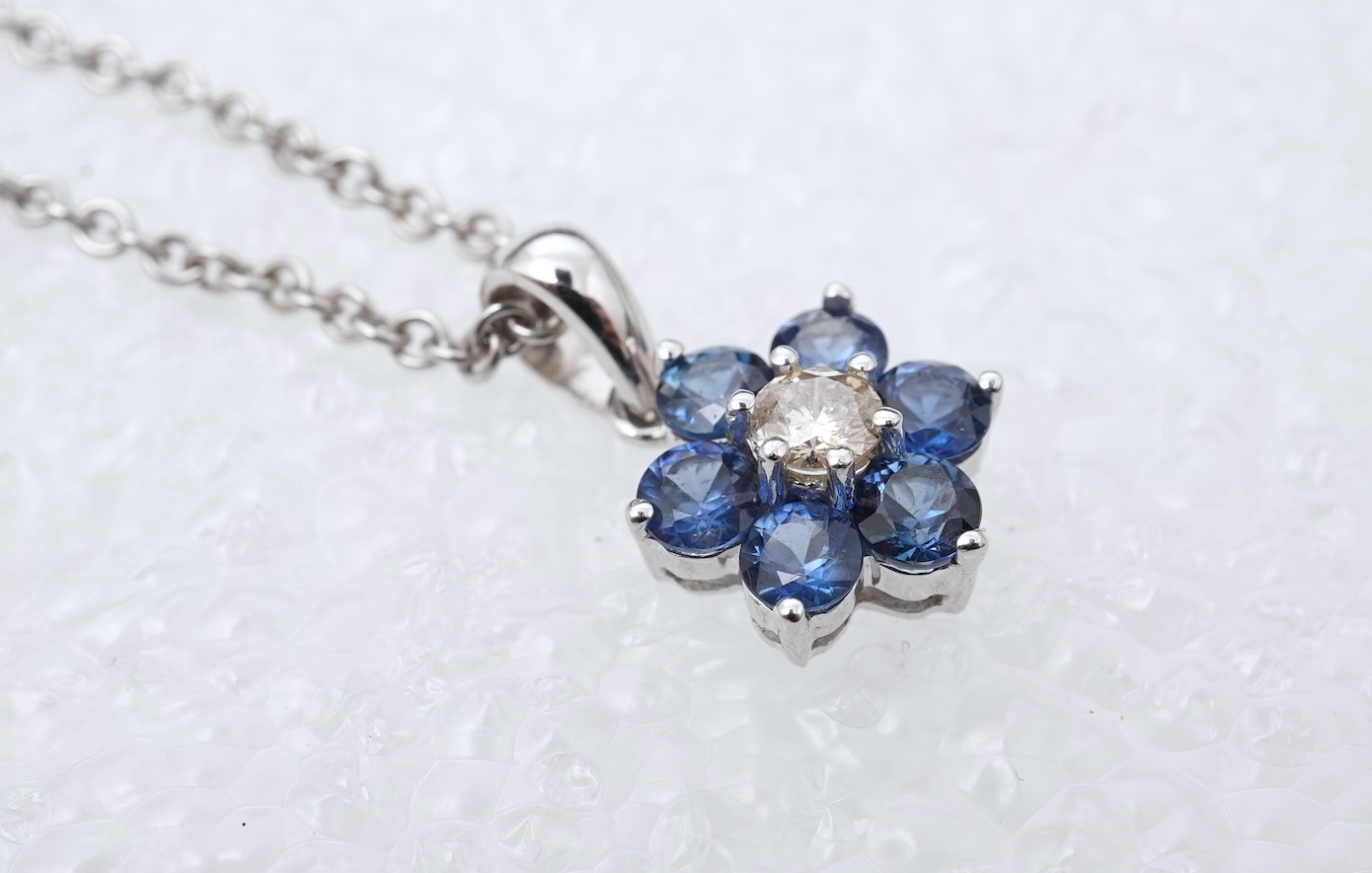 A sapphire and diamond pendant